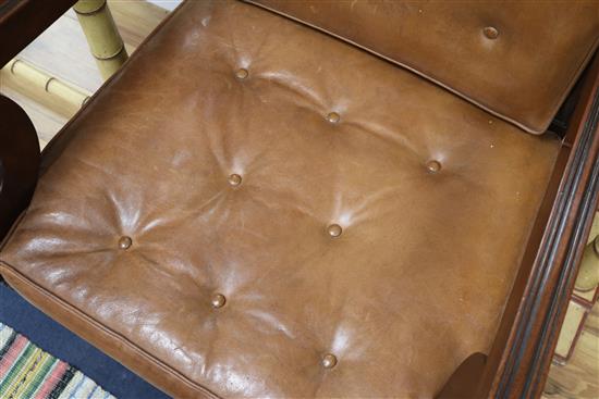 A leather button back bergere chair